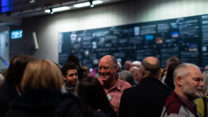 People socialise on the RNCM concourse. 